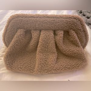 Themoire teddy clutch in camel. NWT and complete with strap and dustbag